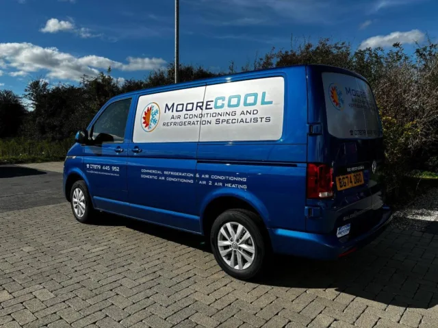 Blue van with MooreCool branding for refrigeration and air conditioning specialist services